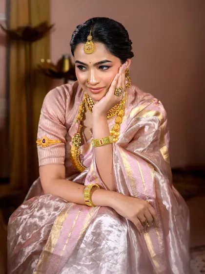 A pensive and beautiful portrait. The makeup here is all about enhancing natural beauty, with a focus on flawless skin and softly defined features.