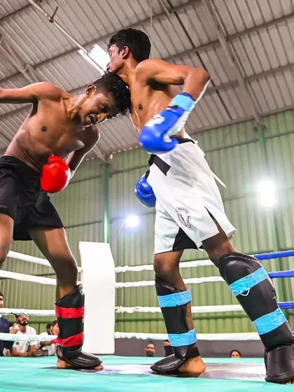 In the clinch during a competitive kickboxing bout, our coach Vinod demonstrates control and resilience. This aspect of stand-up fighting is a critical component of our Muay Thai and kickboxing curriculum.