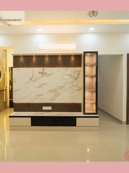 A glimpse into a complete living space we designed in Chromepet, featuring a marble-finish TV unit with fluted panels, integrated display, and an elegant, traditionally carved pooja unit door.