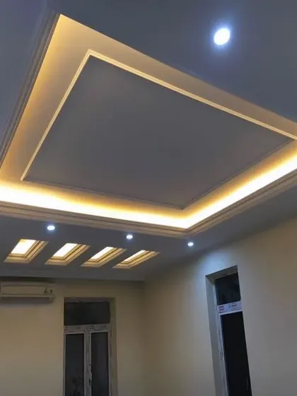 A classic tray ceiling design elevated by beautiful, warm cove lighting. This technique provides a soft, indirect glow that makes a room feel cozy and sophisticated.