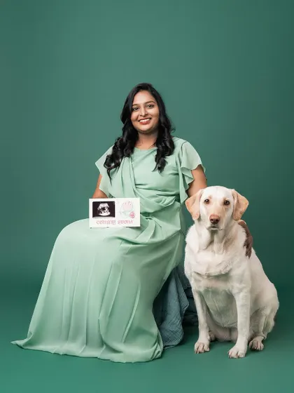 A lovely portrait of the mother-to-be and her dog, holding the ultrasound picture. It’s a beautiful way to include your furry friend in the very beginning of your journey.