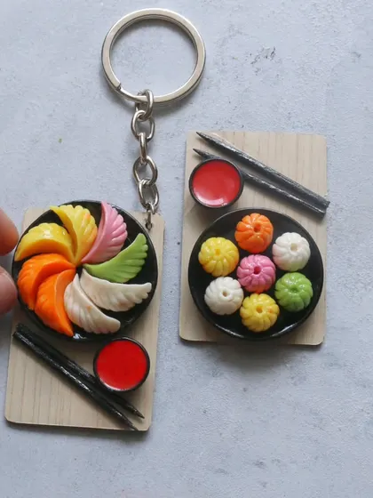 Another shot of the colorful momo keychains, a fun and unique accessory.