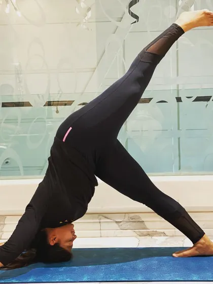 This is Three-Legged Downward Dog, a great pose for opening the hips and stretching the hamstrings. I always remind myself to feel gratitude for what my body can do each day.