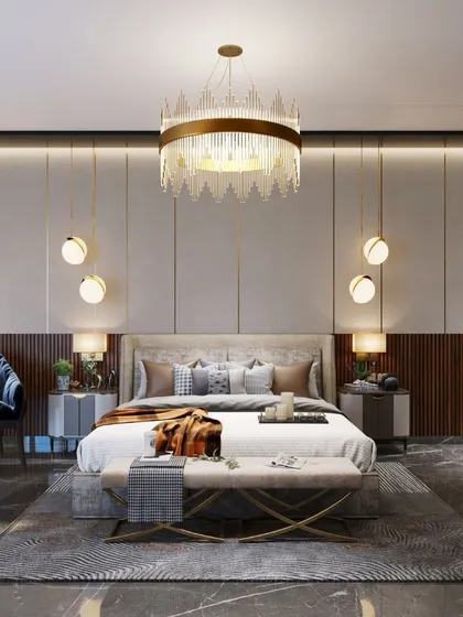 A beautifully curated bedroom with a statement crystal chandelier, elegant wall paneling, and a mix of textures that create a sophisticated and comfortable retreat.