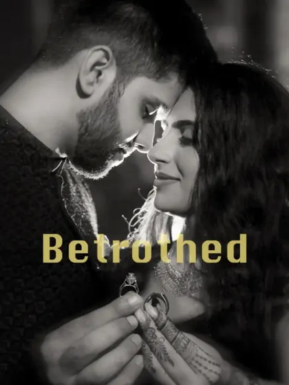 A stunning black and white shot capturing the moment of betrothal, with the couple holding their rings in the foreground. A truly symbolic and artistic portrait.