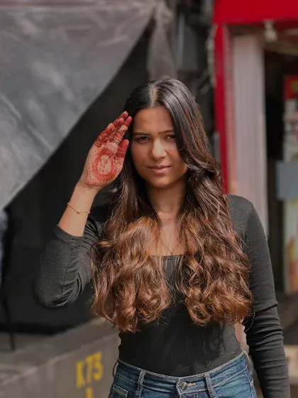 Our client looking confident and beautiful with her new balayage and soft waves.