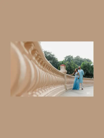 An artistic shot using architectural lines to frame the couple during their Haldi event at the Westin Mumbai. This composition adds a sense of scale and design to the portrait.