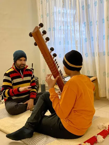 In the Guru-Shishya tradition, communication is key. I explain the nuances of a phrase, ensuring the student understands the feeling behind the notes, not just the technical execution.
