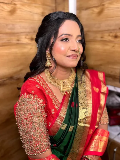 A side profile showing the beautiful contour and highlight that defines her features, along with the intricate details of her embroidered blouse.