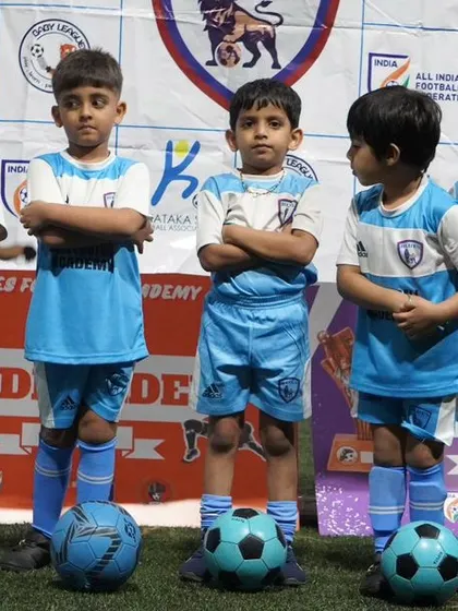 The toddler team posing with confidence, ready for their first taste of competitive football.