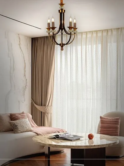 Here, the chandelier's warm glow transforms the living space into an extraordinary realm of beauty. The lighting works in concert with the decor to create a truly opulent and inviting atmosphere.