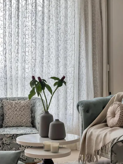 Happiness is a well-styled couch. Here, I've used a mix of pillows in varying textures, patterns, and colors to add personality and warmth, turning a simple sofa into an inviting focal point.