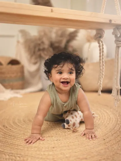 A happy crawler exploring the studio during his sitter session. Capturing these moments of movement and joy is key to documenting this fun stage.