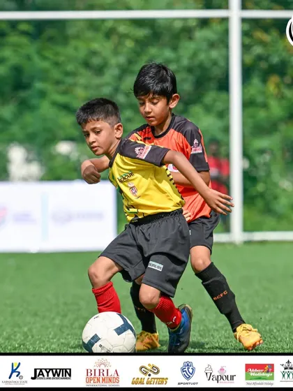A physical battle for the ball. Our players are taught to compete fairly but fiercely for every possession.