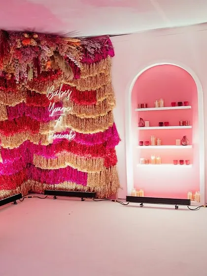 The "Fireworks" theme was all about evoking emotion. We used walls with song lyrics, tinsel backdrops, and dramatic lighting to create a dynamic and inspiring atmosphere.