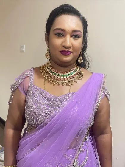 A bold and glamorous look for a wedding guest. I used a purple smokey eye and a deep berry lip to complement her lavender lehenga.