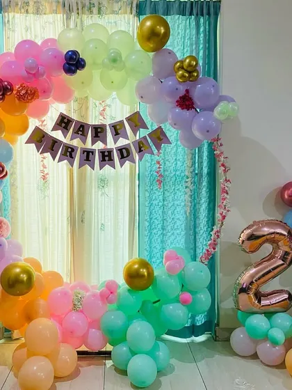 A vibrant, multi-colored balloon ring for a 2nd birthday party, perfect for a fun and cheerful celebration.