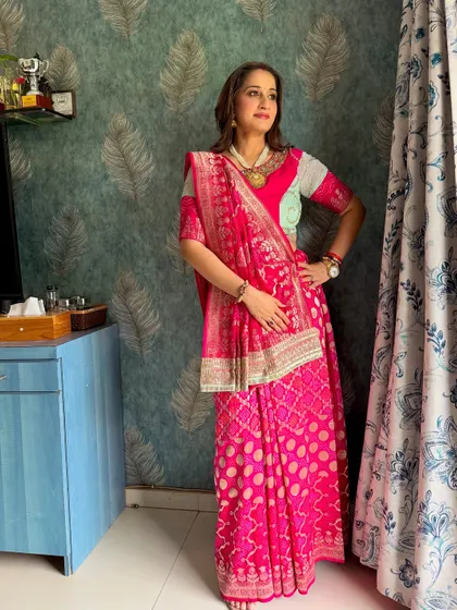 A full-length shot of the client, looking elegant and traditional in her beautiful saree.