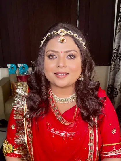 A smiling portrait of our bride, looking radiant in her traditional Haldi attire.