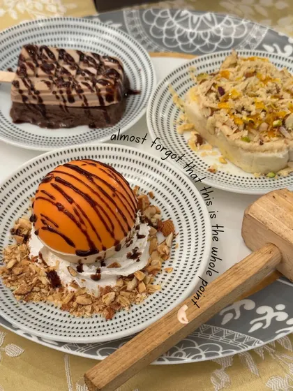 Don't forget the whole point of the wedding: the desserts. This platter features our famous smashable chocolate ball dessert, complete with a wooden hammer.