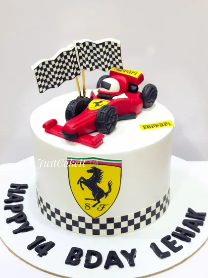 An all-edible Ferrari theme cake for a 14th birthday. The design is sleek and simple, focusing on the iconic logo and a hand-molded F1 car.