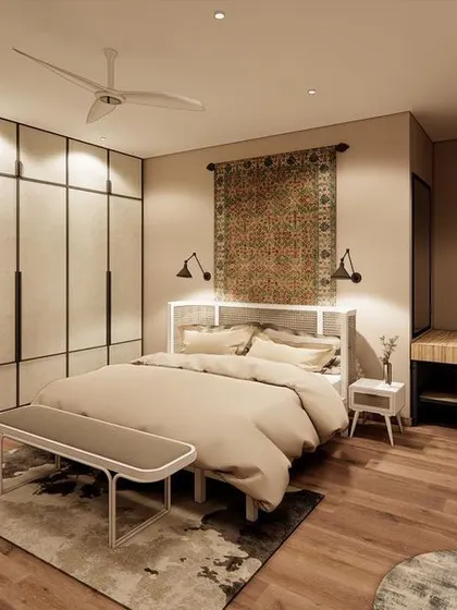 A bedroom concept designed for an older couple, featuring a classic rug as a headboard. The fabric-paneled wardrobes and simple, clean-lined furniture create a space that is both elegant and comfortable.