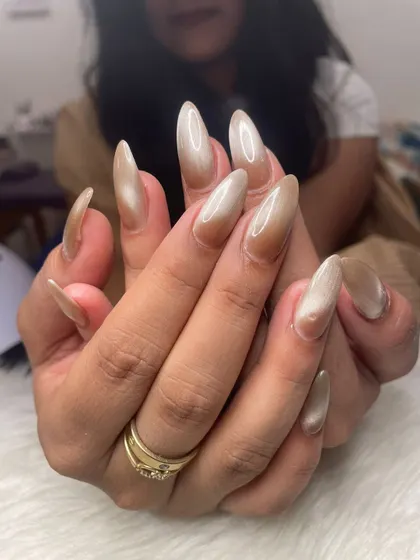 Another angle of the neutral cat eye nails, showing how the light catches the shimmer.