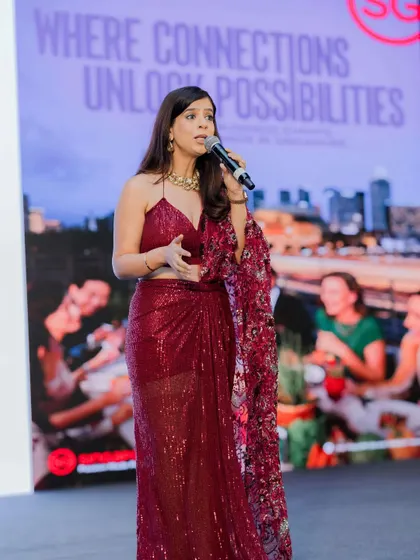 Addressing the audience at the Singapore Tourism event. The backdrop, "Where Connections Unlock Possibilities," perfectly matched my goal for the evening: to create an engaging narrative that fosters networking and partnership.