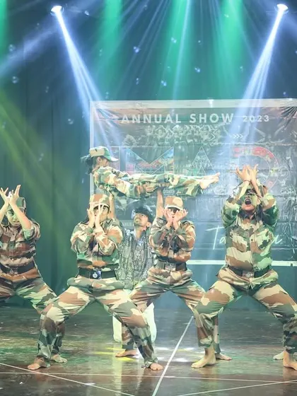 A powerful tribute performance by our students in army-inspired costumes. This act showcases strength, discipline, and complex formations, including impressive lifts.
