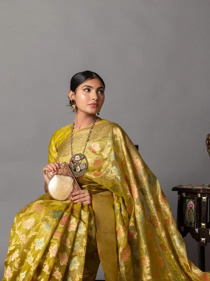 I provided creative styling and art direction for this Zari Jaipur shoot, featuring a stunning handloom Banarasi saree. I paired it with a statement tribal necklace and an embroidered bag to create a rich, artistic, and traditional look.