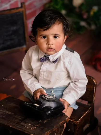 A gallery of our popular school and library theme. These images show the versatility of the brick wall backdrop, mini school desk, globe, and book props for creating a variety of scholarly and classic portraits.