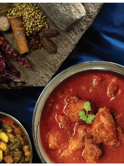 Balu Kaka’s Chicken Curry from Aversa, Karnataka. This aromatic curry, once a taboo dish, became a family favorite after an uncle dared to break the rules and try it.