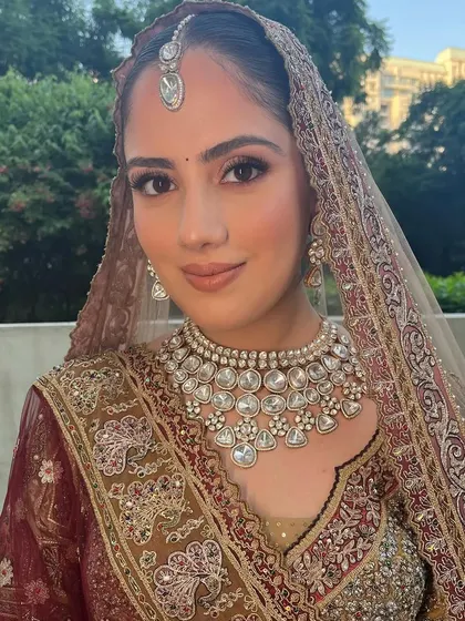 A classic bridal portrait. The makeup is timeless and elegant, proving that less is often more when it comes to bridal beauty.