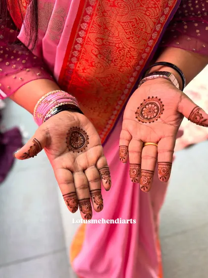 Minimalist mandalas for a guest who wanted something simple yet traditional. The designs are different on each hand for a unique touch.