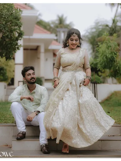 A dynamic shot of the bride-to-be walking down the steps while her partner watches, creating a beautiful narrative moment.