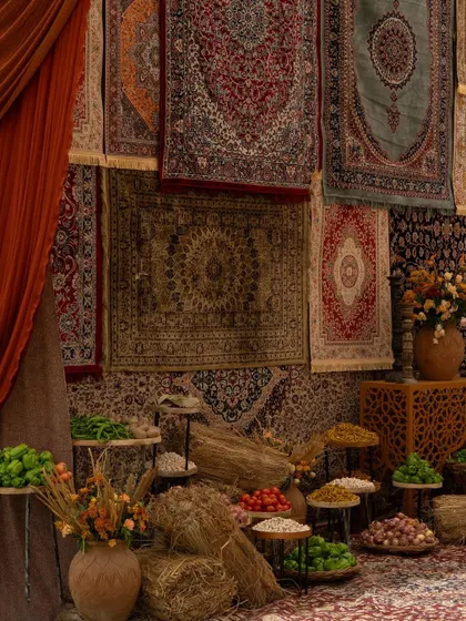For a Haldi in Srinagar, I recreated a traditional Kashmiri bazaar, complete with displays of fresh produce, spices, and a backdrop of authentic carpets.