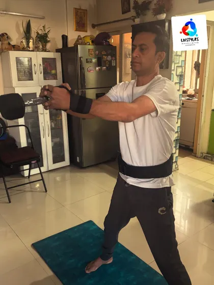 I'm demonstrating a standing dumbbell twist, an effective core exercise that also engages the shoulders. Proper form is key to targeting the obliques and protecting the spine.