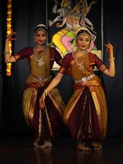 A moment of perfect synchronicity during a duet performance for World Dance Day. Dancing with a partner brings a unique dynamic of contrast and connection to the stage.