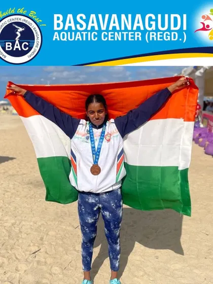 Nakshatra holds the Indian flag after winning a bronze medal at the UIPM Modern Pentathlon World Championship in Egypt. We provide the swimming training component for talented multi-sport athletes like her.