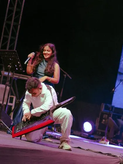 Sharing a fun moment on stage with my keytarist as he nails a solo during our show in Pune. Our performances are all about this kind of spontaneous energy and interaction.