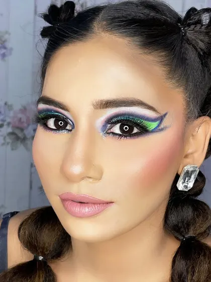 A hi-fashion makeup demo for my students. This look features bold, graphic shapes and a blend of vibrant colors, showcasing advanced techniques and creativity.