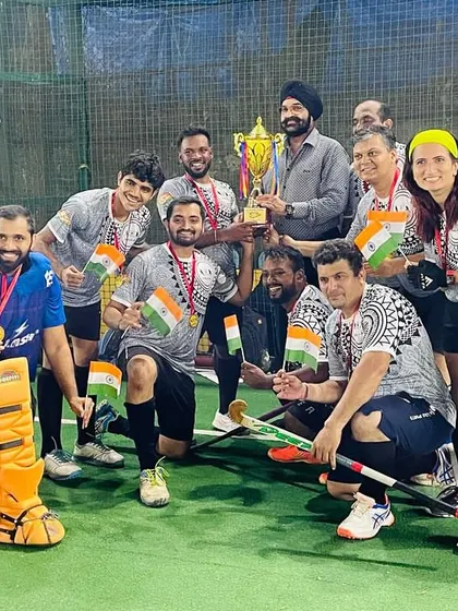 Another winning team celebrates with their trophy, medals, and Indian flags. These moments of pride and joy are what we strive for.