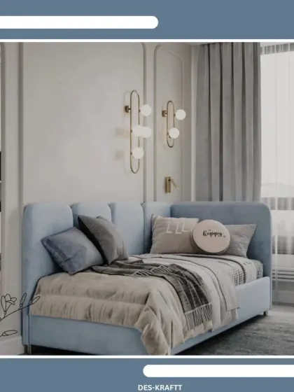 A plush, light blue daybed with soft pillows and throws, complemented by elegant wall moldings and modern sconces.