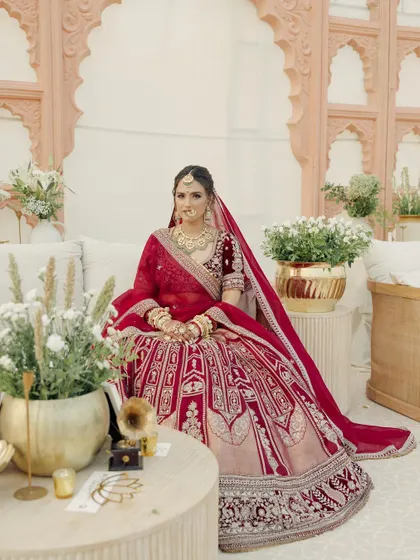 A quiet moment amidst the grandeur. Janvi's makeup was designed to look flawless both up close and from a distance, with a focus on luminous skin and softly defined eyes.
