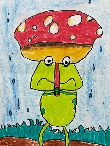 Another student's interpretation of the frog in the rain. This version has a different expression, showing how we teach children to convey various emotions through subtle changes in their drawings.