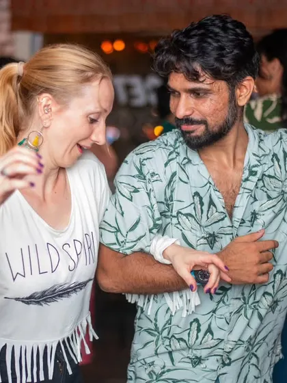 A stylish and confident pair on the dance floor.