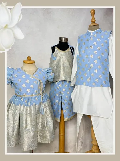 Triple the love with our Mogra collection. This set features a dress, a co-ord set, and a boys' kurta with a Nehru jacket, all coordinated in a beautiful powder blue and silver.
