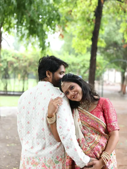 An intimate and loving moment between the couple. Her makeup is soft and pretty, highlighting her happiness.