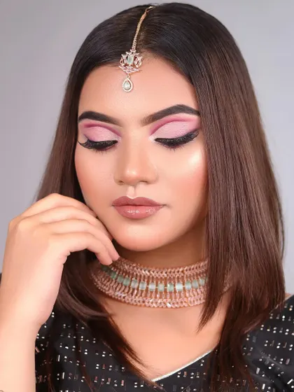 A beautiful pink cut-crease eye makeup look created by a student in our 2-month course. We teach techniques that are both creative and wearable.