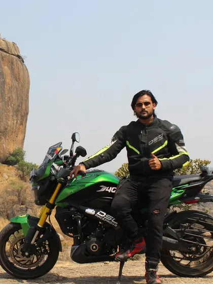 Taking a break with the bike during our Ramanagara exploration. We plan our routes to include scenic stops for photos and relaxation.